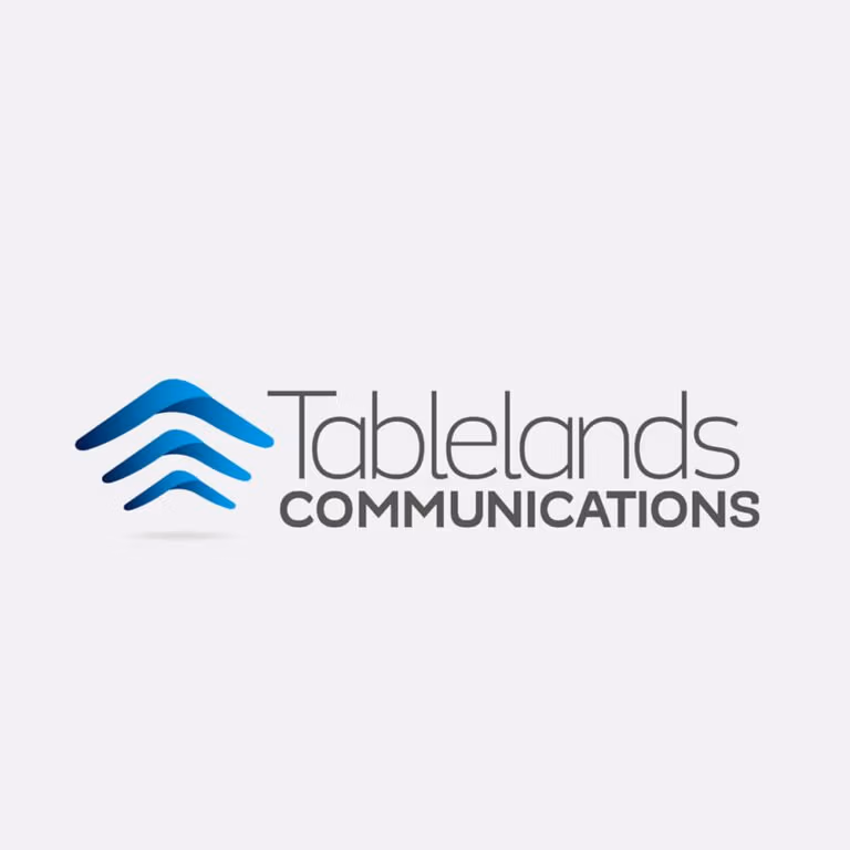 Tableland communications corporate logo on white background with blue boomerangs